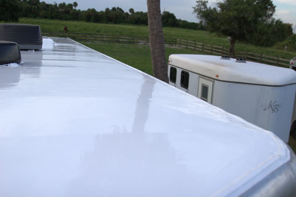 Coated trailer roof edge next to an uncoated weathered trailer